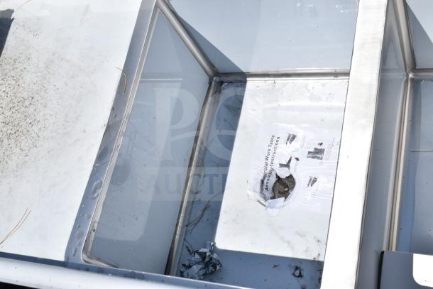 BRAND NEW SCRATCH AND DENT! Regency 600S21824224 commercial 2 bay sink with dual drain boards, slight scratches visible.