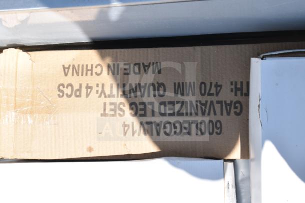 Packaging for Regency 600S21824224 Commercial Sink with dual drain boards. Marked "Made in China" and "Galvanized Leg Set."