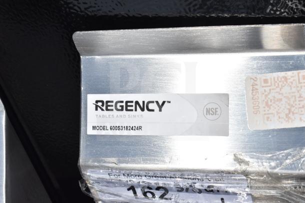 Regency 600S3182424R commercial 3-bay sink, new with scratch and dent. Includes right side drainboard. Model and NSF label visible.