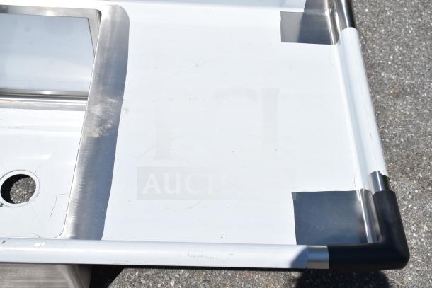 Brand new Regency 600S3182424R 3-bay commercial sink with right side drain board. Some scratches, protective film partially intact.