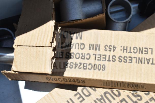 Cardboard packaging for a Regency 600S3182424R Commercial 3 Bay Sink with markings indicating stainless steel construction.