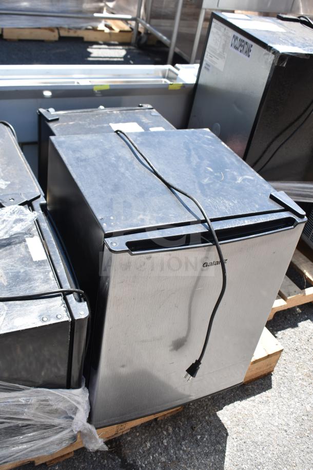 Four mini coolers including Galanz GL27S5, Galanz GL17BK, Magic Chef HMAR170BE, 1 phase 120V, on wooden pallet.