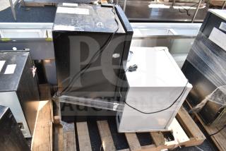 Two mini coolers on a pallet: West Bend WB0310RCRXB and Accucold FFAR23L, 120V, 1 Phase, showing power cords.