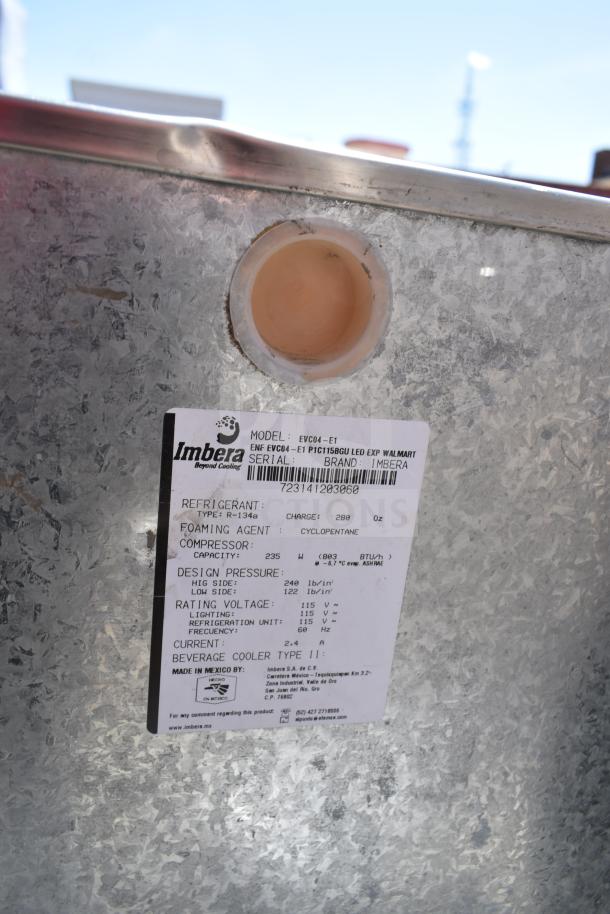 Alt text: Label on Imbera EVC04-E1 mini cooler shows refrigerant, compressor specs, and voltage details. 120 Volts, 1 Phase.