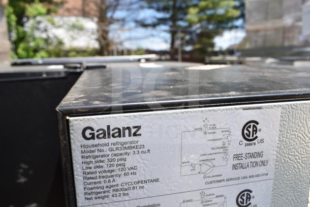 Three mini coolers: Galanz GL35BK, Vissani HVAR32SE, Galanz GLR33MBKE23, 120V, 1 phase. Image shows model label on cooler.