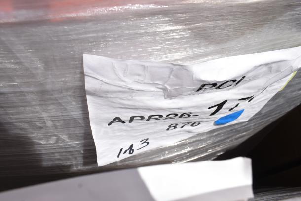 26 Lancaster Table & Seating Rio Sunset Orange Resin Side Chairs, new, scratch and dent, wrapped with label "APR26-177."