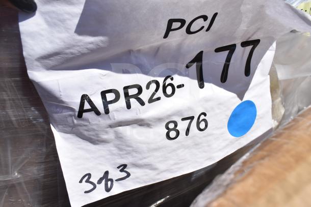 Close-up of auction label showing "APR26-177." Background hints at packaging of Lancaster Table & Seating chairs.