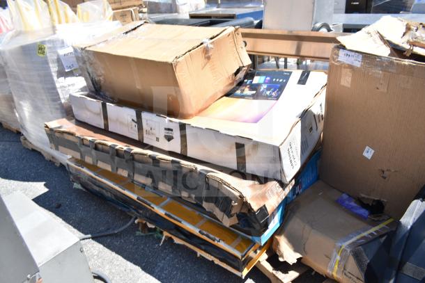 Stack of boxes containing five brand new scratch and dent items, including a sink, with visible damage on packaging.