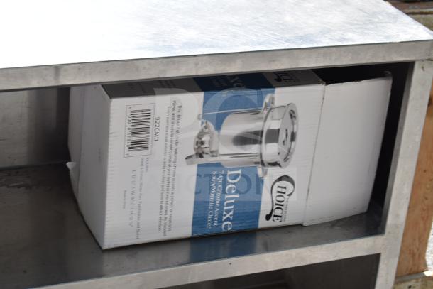 Commercial steel table with two under shelves, mounted can opener, and contents including Choice Deluxe chafer and cutting boards.