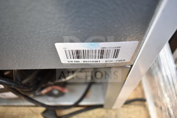 Label close-up on a GE cooler, model GME04GGKWW. Serial number: D80 09259401 16120 210376, displayed on a metal surface.