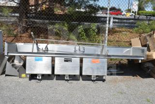 Commercial 3 bay sink with dual drain boards, stainless steel, labeled for wash, rinse, sanitize. Used condition.