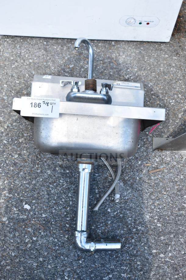 Pantin Single Bay Wall Mount Sink, stainless steel, used condition, includes faucet, visible connection pipes, and mounting bracket.