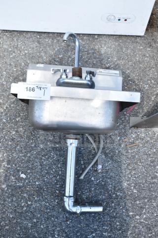 Pantin Single Bay Wall Mount Sink, stainless steel, used condition, includes faucet, visible connection pipes, and mounting bracket.