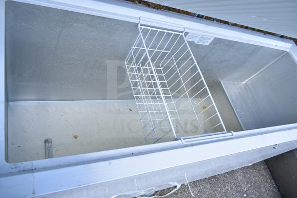 Galaxy 177CF20HC chest freezer, 115 volts, 1 phase, with wire basket. Appears in used condition with interior wear.