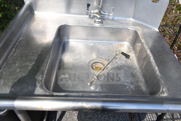 Commercial left side dirty dish table, stainless steel with faucet and drain, showing signs of wear and rust.