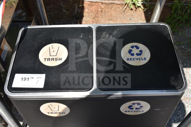 Dual compartment trash can with recycling and trash sections, black exterior, wooden labels, used condition, auction tag visible.