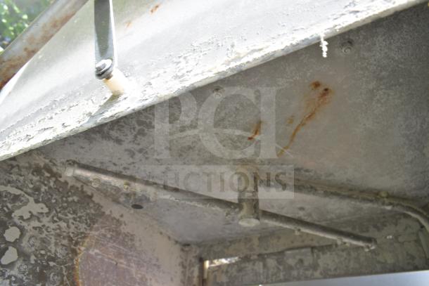 CMA EAH-2 Commercial Dishwasher interior showing wear, rust markings; 120 Volts, 1 Phase model with visible piping.