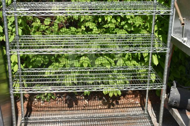 5 tier wire shelving unit with chrome finish. Excellent condition, for buyer dismantling. Freight charges apply.