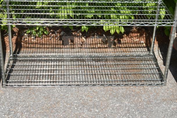 Chrome finish 5 tier wire shelving unit, sturdy condition, requires buyer dismantling for shipping. Ideal for storage.