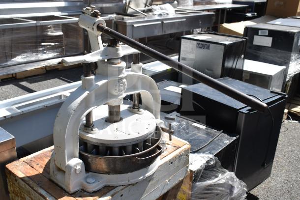 I. Kalfus Co commercial countertop dough divider on wooden stand, metal body, manual lever, used condition.