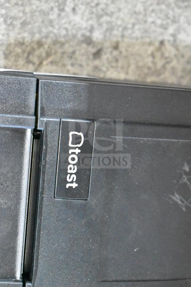 SNBC BTP-M3000 Countertop Receipt Printer with visible 'toast' logo. Slight wear on casing indicates moderate use.