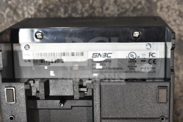SNBC BTP-M3000 receipt printer showing serial number and compliance labels, in good condition.