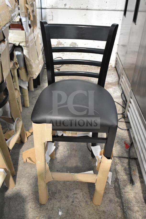 Black bar height chair with black seat cushion, model 164BLADBLKFR, new condition in packaging, minor scratch and dent.