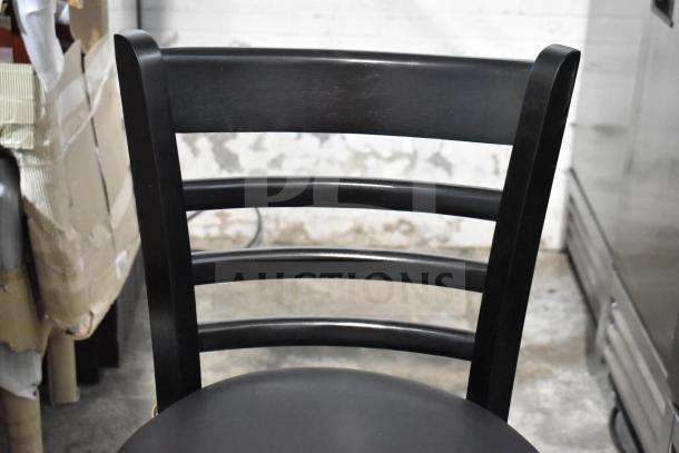 8 brand new 164BLADBLKFR black bar height chairs with black seat cushions. Slight scratch and dent condition.