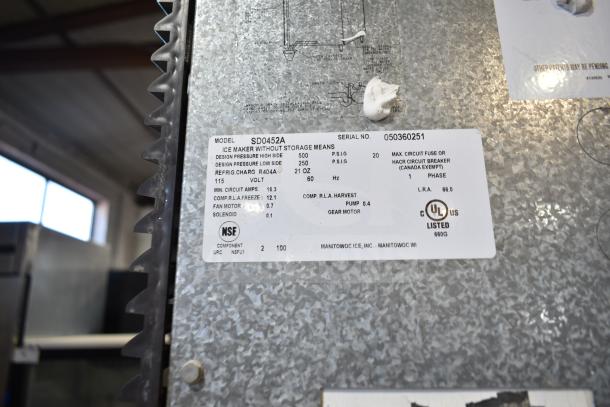 Manitowoc SD0452A Ice Machine Head on SPA310 Dispenser, 115V, 1 Phase, NSF listed. Model and serial number label visible.