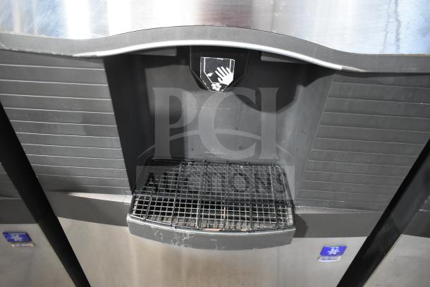 Manitowoc SD0452A ice machine on SPA310 dispenser, 115V, 1 phase. Steel finish, push paddle, hotel model. Visible logo and grate.