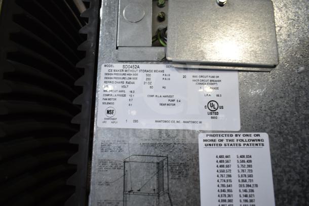 Manitowoc SD0452A ice machine head with SPA310 dispenser, 115V, 1 phase. Includes specifications label showing details.