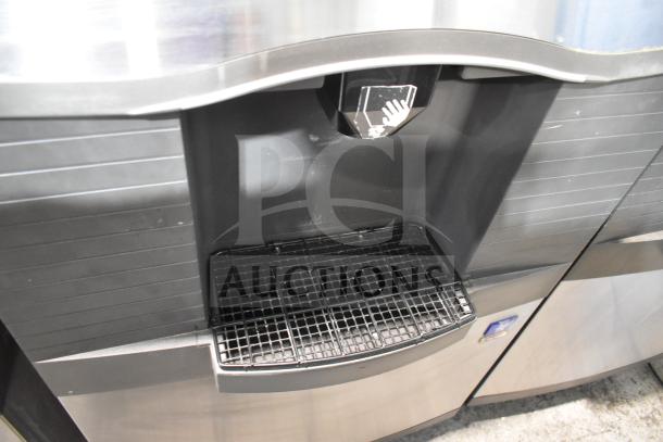 Manitowoc SD0452A ice machine head on SPA310 dispenser; 115V, 1 phase. Features stainless finish and push-button operation.