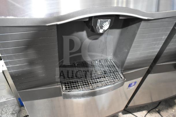 Manitowoc SD0452A ice machine head on SPA310 dispenser, 115V, 1 phase, commercial use. Shows dispensing area and tray.