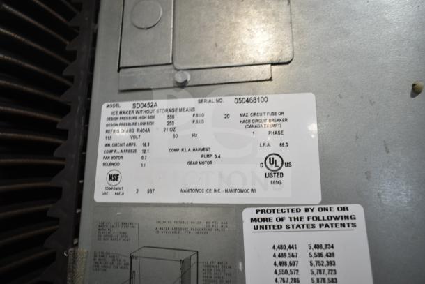Manitowoc SD0452A commercial ice machine head on SPA310 hotel ice dispenser; 115V, 1 phase, detailed specs visible.