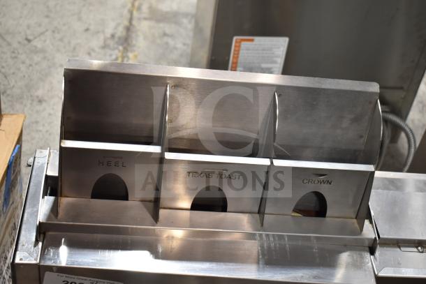 AJ Antunes GST-3V Commercial Vertical Bun Toaster with 1 2/3" openings, labels indicate slots for heel, Texas toast, and crown.