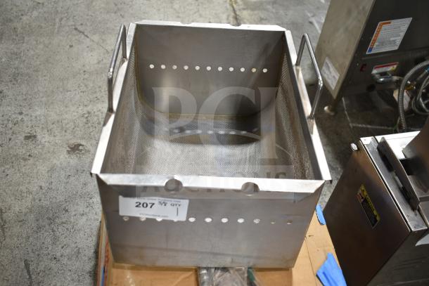 Stainless steel fryer insert with side handles and perforated design, slightly used, auction label "207" visible.
