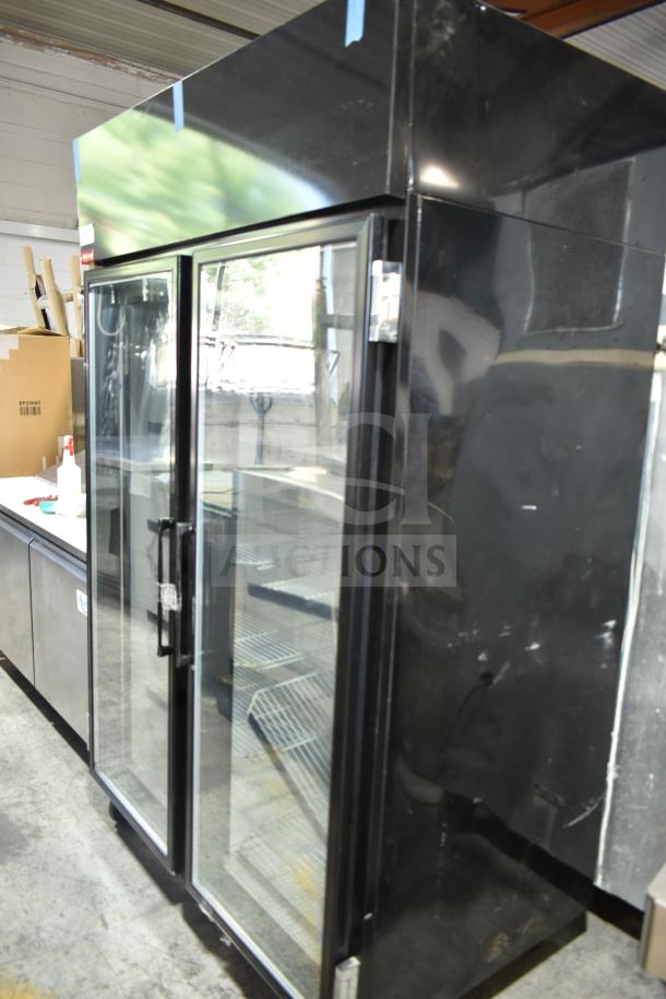 McCray GF48-CAR-BE-DHL 2-door reach-in cooler, black, commercial casters, model shown in a warehouse setting.