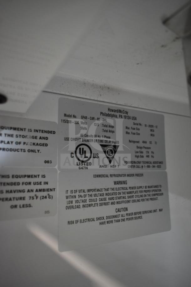McCray GF48-CAR-BE-DHL 2 Door Commercial Cooler, UL listed, 115/208-230V, 1 Phase, on casters. Labels detail voltage and safety warnings.
