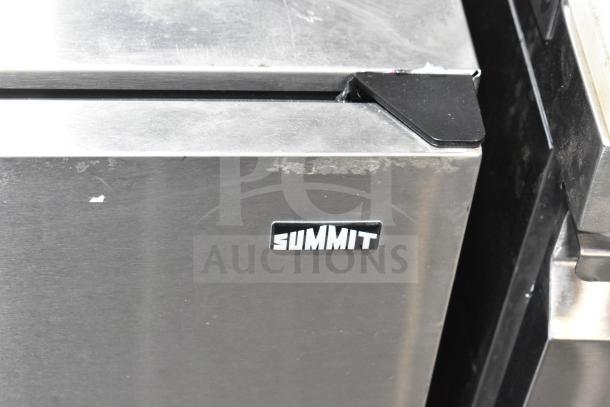 Summit Mini Cooler, stainless steel finish, minor surface wear, visible Summit logo on the front.