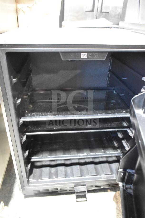 Summit Mini Cooler, black, open with shelves visible, digital display, used condition with slight wear. Model not specified.