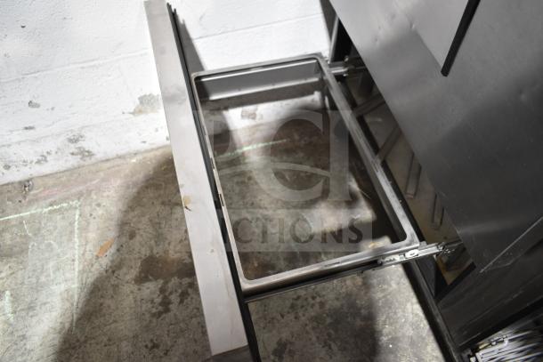 2019 True TSSU-60-16D-2-HC prep table, open drawer view, stainless steel, 115V, commercial use, good condition.