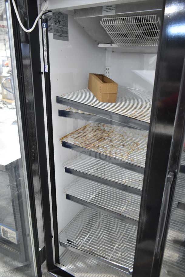 McCray GF48-CAR-BE-DHL commercial 2-door reach-in freezer merchandiser, on casters, shown open with metal shelves.