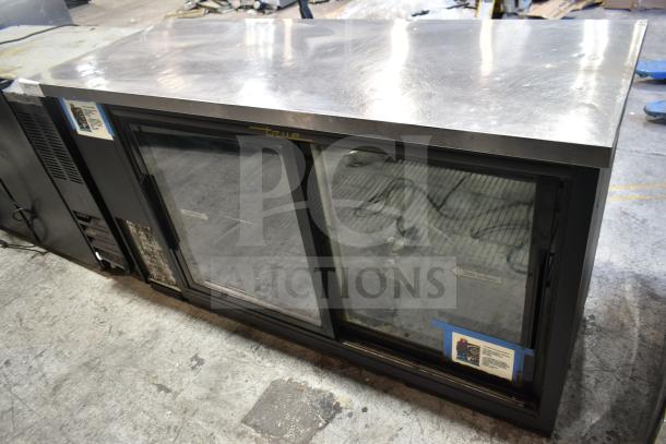 True TBB-24-60G-SD back bar cooler with two glass doors, stainless top, 115 volts, in used condition.