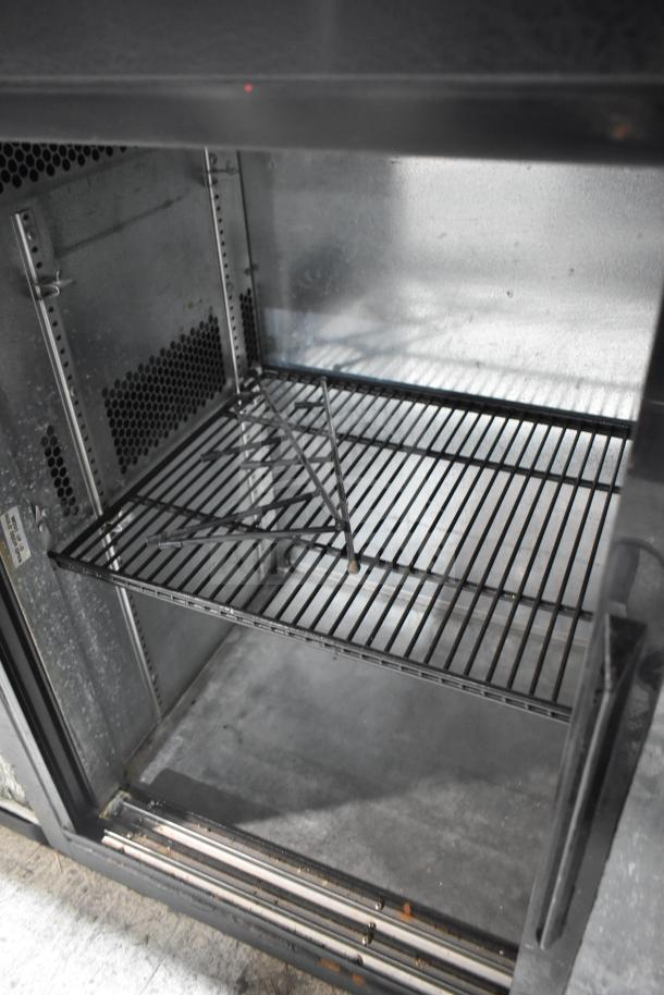 True TBB-24-60G-SD 2 Door Back Bar Cooler, glass shelves, 115V, excellent condition.