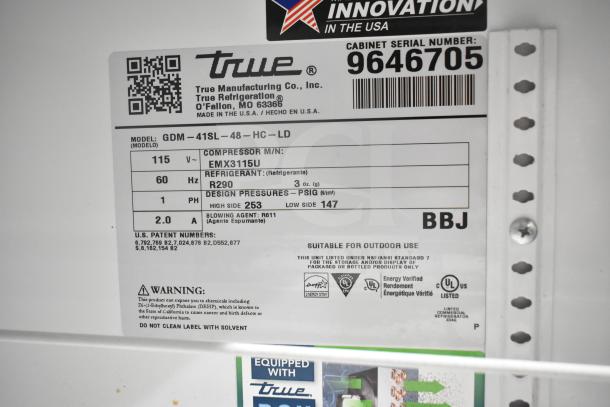 2019 True GDM-41SL-48-HC-LD cooler label showing model details, voltage, phase, refrigerant type, and serial number.