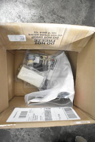 Brown box containing new Pitco B6700608-CL Probe Service Kit and Avantco 36059908 Digital Controller, with visible shipping label.