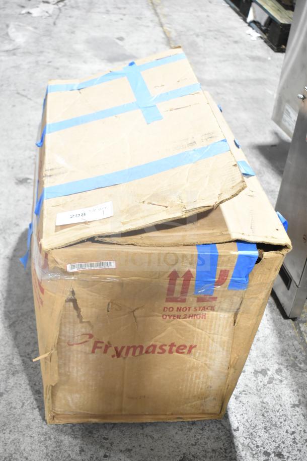 Cardboard box labeled "Frymaster" containing new, scratch and dent Frymaster PF50 oil filter. Box has shipping tape and visible damage.