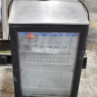 Imbera EVC04-E1 Mini Cooler Merchandiser, 115 Volts, 1 Phase. Features clear display door with Coca-Cola sticker.
