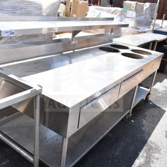 Commercial prep table with four round cutouts, two drawers for sauce pots, on commercial casters. Stainless steel.