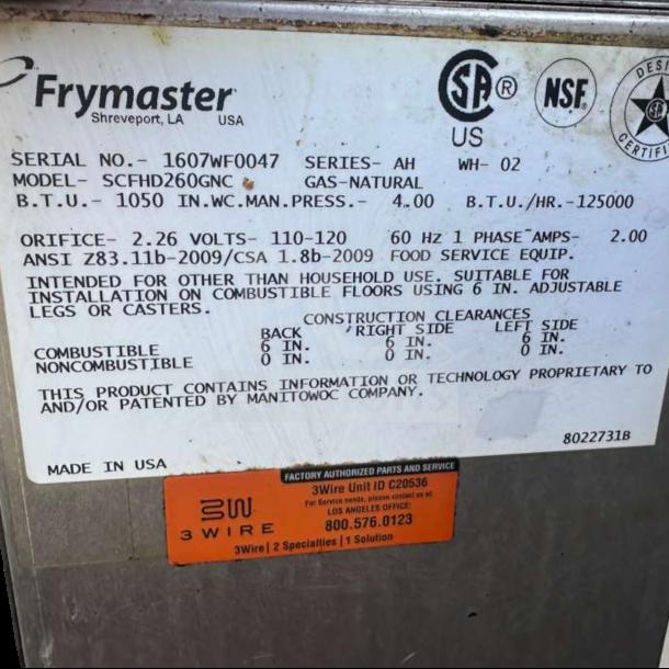 Frymaster SCFHD260G gas fryer label displaying model, BTU, volt specifications, and ANSI standards. Made in USA.